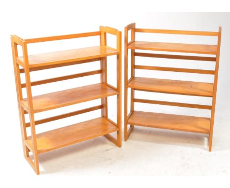 Pair of modern hardwood folding bookcase shelf units. With support to either side, three folding shelf platforms with a serie