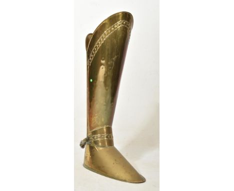 A 19th Century Victorian walking stick stand / coal scuttle in the form of a large gentlemen's boot. Brass construction with 