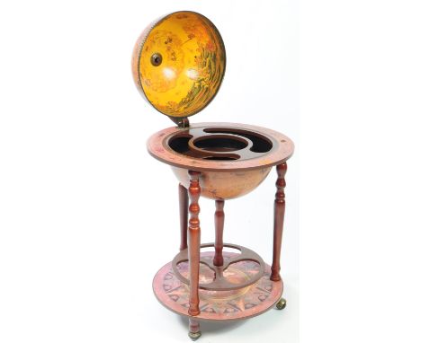 A 20th Century vintage terrestrial mahogany veneer globe drinks cabinet with hinged lid to reveal decanter cocktail cabinet, 