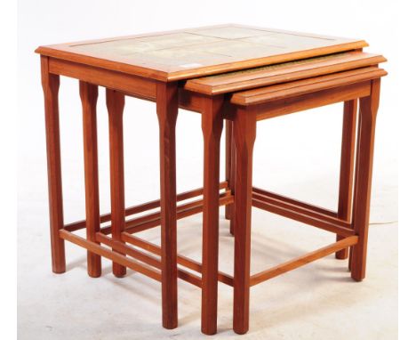 Danish Modern Design - Toften Mobelfabrikken - A mid 20th century teak tile top nest of tables. The tables raised on squared 