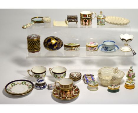 A quantity of pill boxes to include examples by Limoges and Noritake, coffee cans and saucers by Royal Crown Derby, a pierced