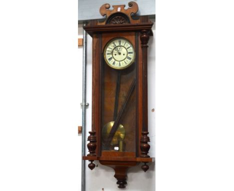 An early 20th century mahogany cased Viennese regulator wall clock, the enamel dial set with Roman numerals, length 115cm (af