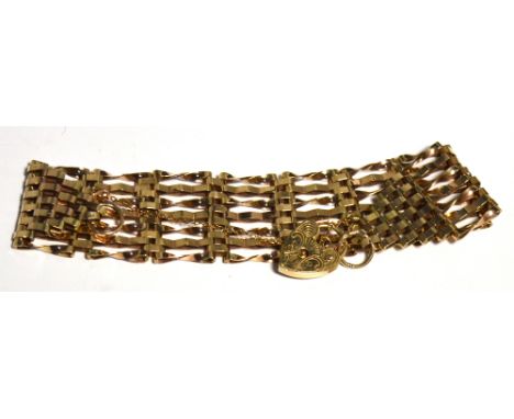 A 9ct gold seven bar gate bracelet with padlock and chain, approx 16g.