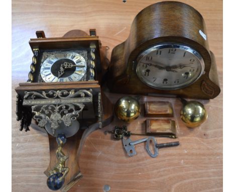 An oak cased mantel clock by Enfield, the silver dial set with Arabic numerals and a reproduction wall clock by Wuba (2).