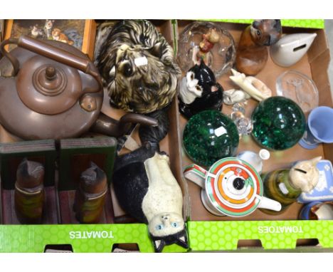 Two boxes of collectibles to include a large metal doorstop in the form of a cat, wooden bookends in the form of cats, a larg