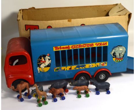 A Triang pressed steel circus van model no.307, blue body, red cab, complete with eight circus animals and original box, leng