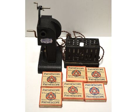 A Pathescope 9.5mm cine projector with six films to include Mickey Mouse (7).