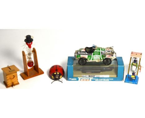 A wooden Steiff money box, a model of an aurora bird with glass vial in side, a Lledo special limited edition diecast model o