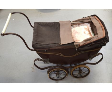 A 1950s vintage dolls pram by Morris, Wilkinson & Co, Nottingham bearing the logo "Sirrom" to the front, length 90cm.