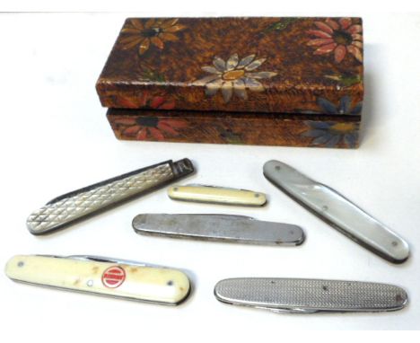 A small wooden box containing six penknives to include a silver and mother of pearl example. a bone example etc, an A.A. asht