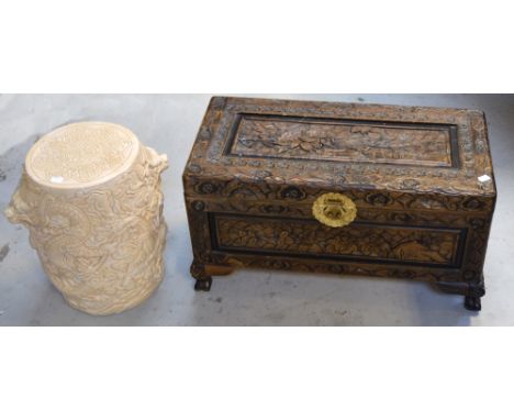 A 20th century heavily carved Oriental chest of small proportions with brass fittings, width 69cm and an Oriental ceramic cre