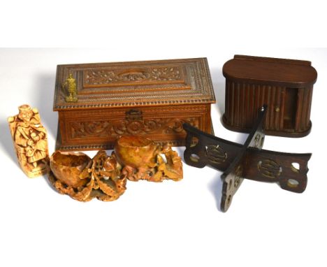 An early 20th century Indian carved trinket box, a cigarette box with sliding cover, two Oriental soapstone ornaments and an 
