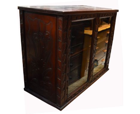 A 20th century mahogany glass front cupboard with carved leaf decoration, one interior shelf, 60 x 80cm and a mahogany fire f