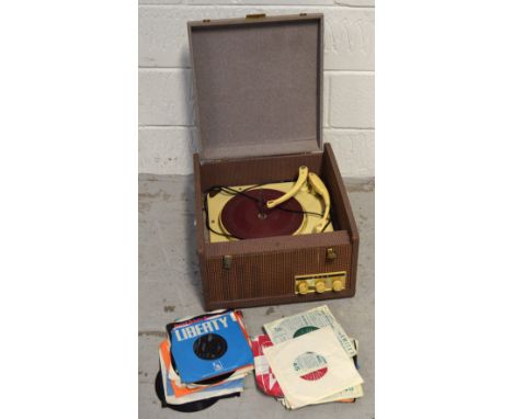 A vintage Ekco record player and a small quantity of singles to include "You Can't Do That" by The Beatles, "The Boy of my Dr