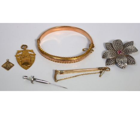 A 9ct rose gold bangle, a 9ct gold fob, a small 9ct gold St Christopher, a gold brooch and two further silver/white metal bro