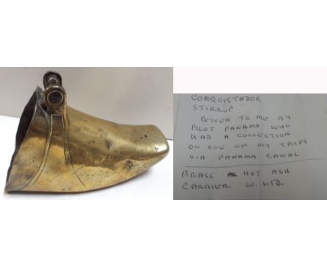 A 19th century Conquistador brass stirrup, (Given to the vendor by a pilot on the Panama canal who had a collection of the sa