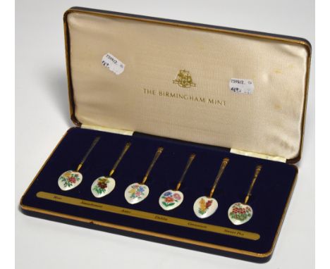 A cased set of six Elizabeth II hallmarked silver gilt and enamel tea spoons, Birmingham 1978, approx 2.5ozt.