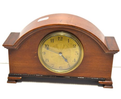 An early 20th century mahogany cased mantel clock, the gilded dial set with Arabic numerals, 24 x 15cm.