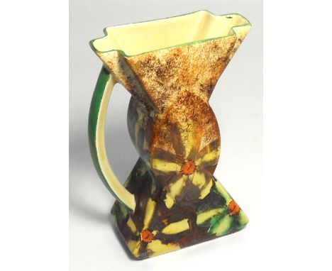 An Art Deco water jug by Myott and Sons in the "Bow tie" style decorated with floral designs, height 22cm.