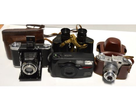 A cased Comet camera, a cased Pentax camera, a Zeiss Ikon camera and a pair of binoculars (4).
