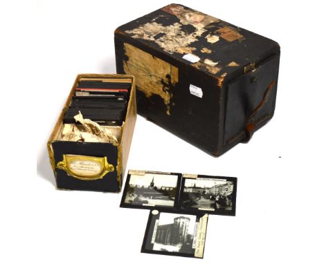 A 19th century ebonised box containing approximately 40 lantern slides with themes to include views of Copenhagen with paper 