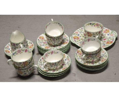 A quantity of Minton "Haddon Hall" pattern teaware to include cups, saucers, milk jug, sugar basin and a sandwich plate.
