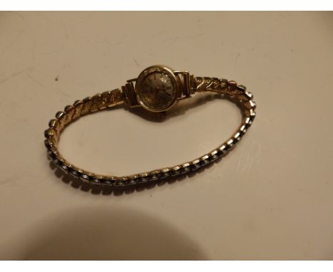 An 18ct gold lady's Rotary wrist watch on plated strap.
