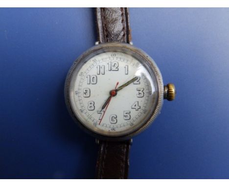 A silver WWI  'trench' wrist watch with luminous hands - white enamel dial cracked - a/f.