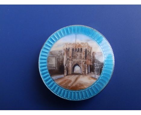 An Edwardian silver circular pill box, the detachable enamelled cover showing a view of Southampton Gate within blue guilloch