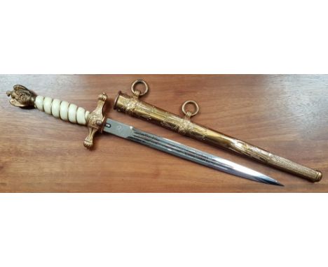 A German WWII German naval dress dagger with Eickhorn blade - some cracking to hilt.