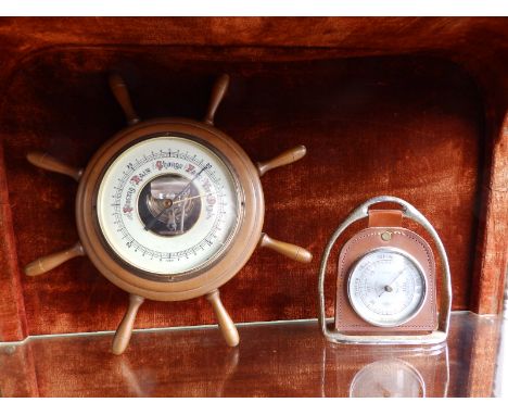 A small 20thC ship's wheel barometer and one other. (2)