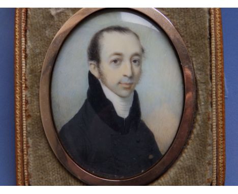 Charles Jagger - An early 19thC oval watercolour miniature portrait of a gentleman in a black jacket with high collar, 2.5" h