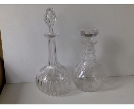 A cut glass globe &amp; shaft decanter and one other. (2)