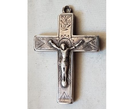 A small antique silver reliquary cross, having hinged cover revealing internal compartments, 2" high.