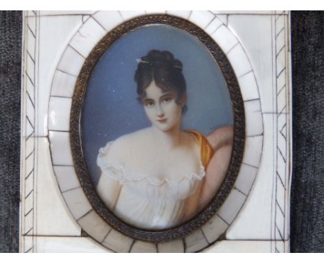 After David - an early 20thC miniature portrait of Madame de Recamier, signed, 3.5" high oval - possibly painted over a photo
