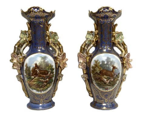 A pair of Continental vases, decorated with Red Deer and Hunting Dogs, circa 1900,  each or waisted form, with light blue gro