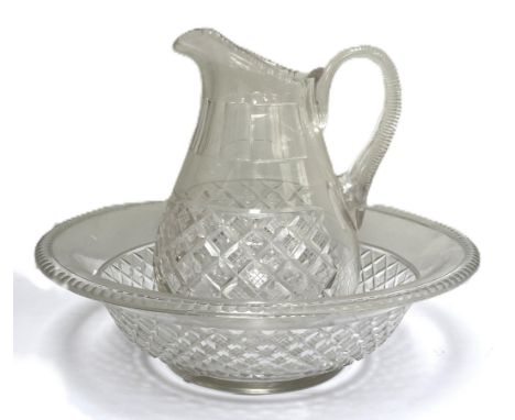 A large late 19th century glass water jug and basin, possibly Irish,   the wide deep bowl with chevron cut decoration (crack 