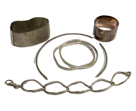 Assorted silver and white metal jewellery, including a modern silver torc, hallmarked; a white metal bangle, marked 925; a Co