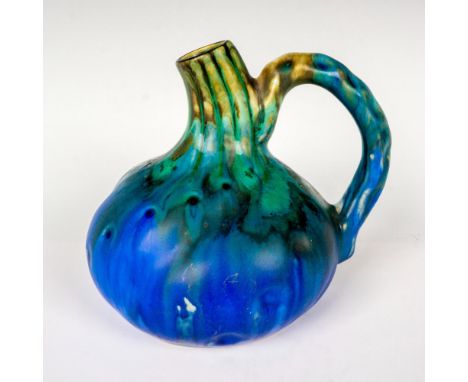 Handcrafted ceramic handled jug decorated in a blue green drip glaze. Signed G. Metenier to underside. Artist: Gilbert Meteni
