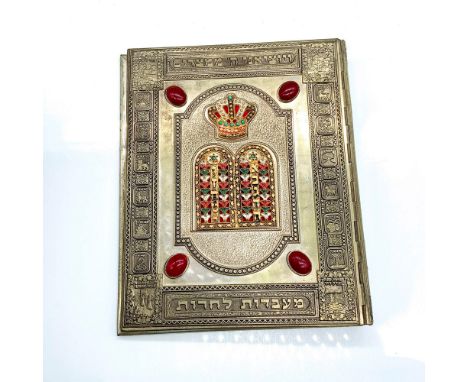 Finely detailed gold tone metal book cover with finely detailed Jewish symbols, Hebrew writing, and gemstone and enamel accen