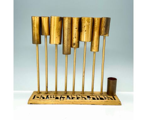 Rare brass Hanukkah menorah lamp by Oppenheim, shaped like tubes, base decorated with piercing reading These candles are holy