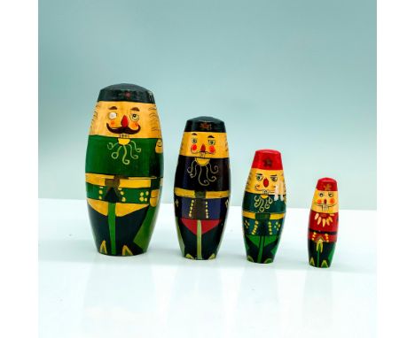 A set of four wooden Russian nesting dolls that depict Russian soldiers in different uniforms. Dimensions of the largest item