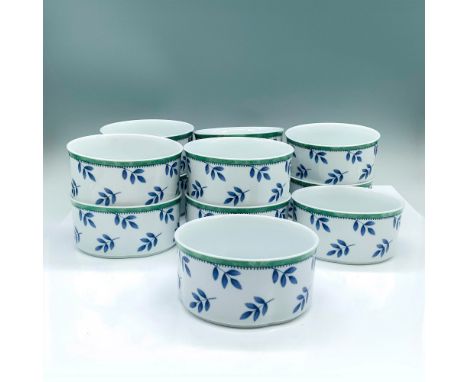 A set of 12 porcelain bowls that share the same design of blue leaves with a green accent border. Villeroy and Boch backstamp