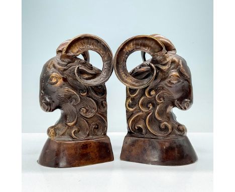 Admire a stunning pair of cast bronze sculpted ram's heads, showcasing exquisite craftsmanship and artistry. Dimensions: 4"L 