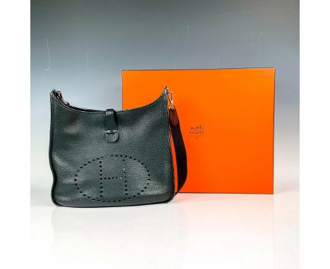 Chic black sophisticated leather satchel purse with girth-like shoulder strap. Features a semi-matte smooth feel with the per