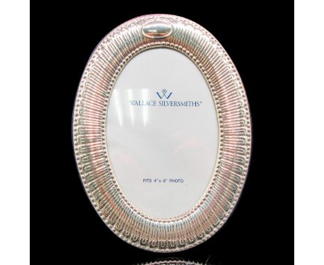 Beautiful glass and silver frame with blue velvet back. This item has its original box: 8.5"L x 7"W x 1"H. Issued: 20th centu