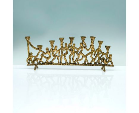 A menorah that has the bases of the sconces being depicted as silhouettes of people gathering together and helping one anothe