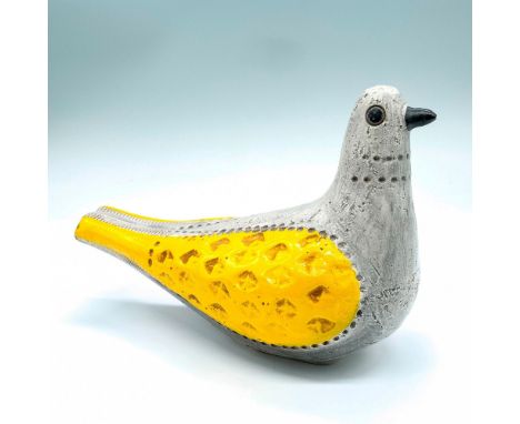 Beautiful unmarked ceramic bird with matte grey body and glossy yellow wings. Artist: Aldo LondiDimensions: 9"L x 5"W x 6"HCo