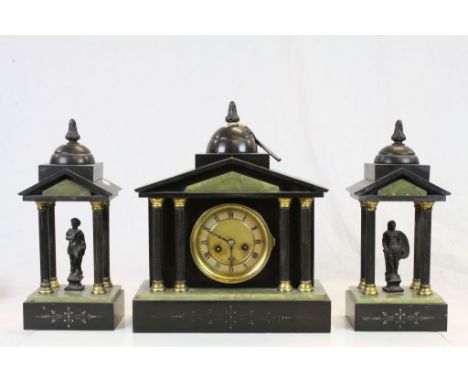 Key wind striking Marble & Onyx Mantle Clock with Garnitures, and in Romanesque style