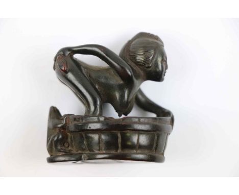 Carved hardwood erotic netsuke depicting a bathing woman and frog